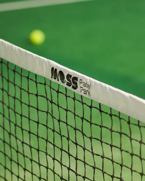 Net tape printed with the Moss Padel Park logo