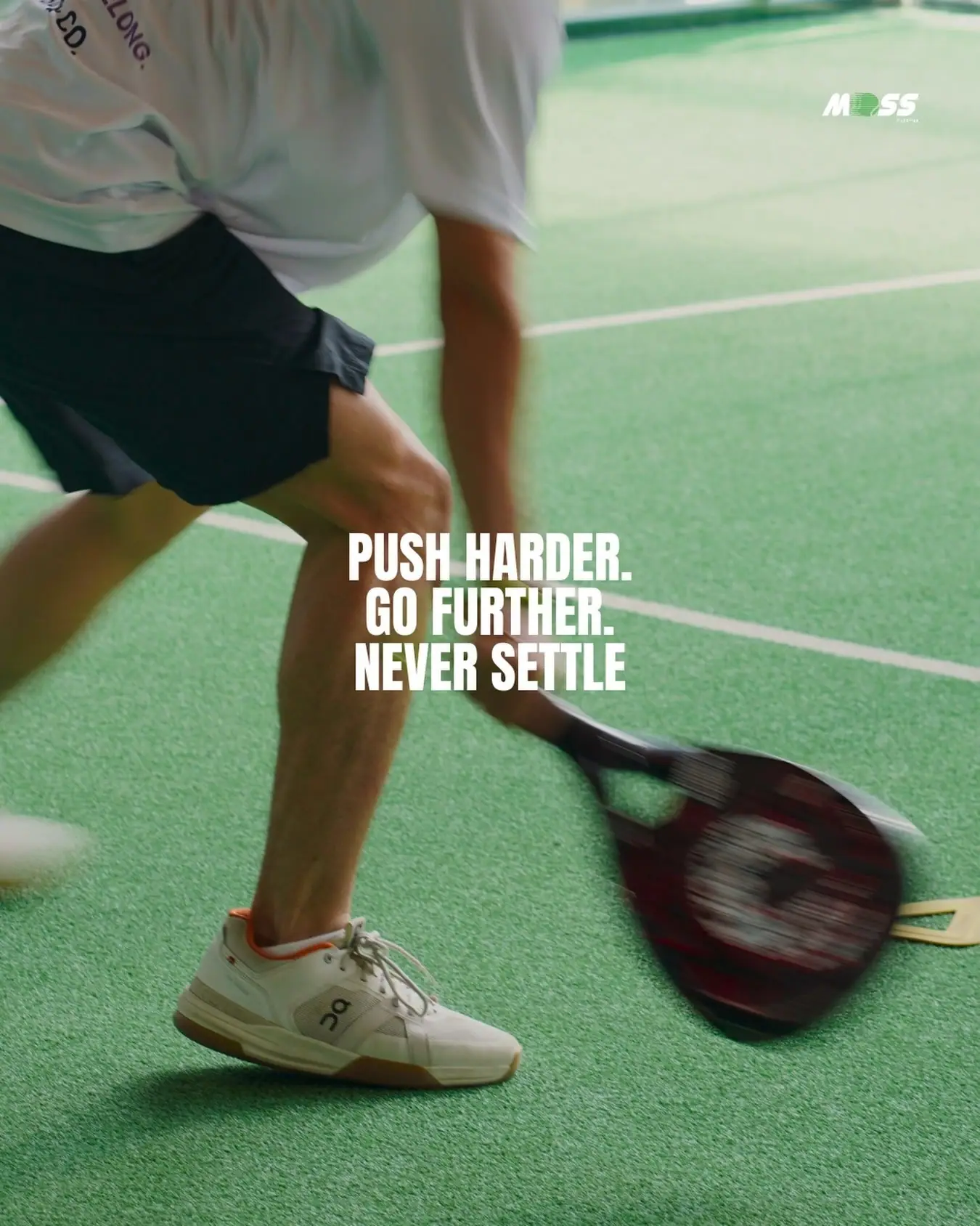 Player lunging with the line 'Push harder. Go further. Never settle.'